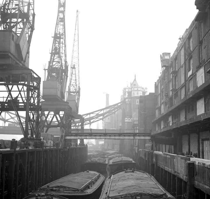 The Long Memory-Barges unloading at St. Katherine Dock